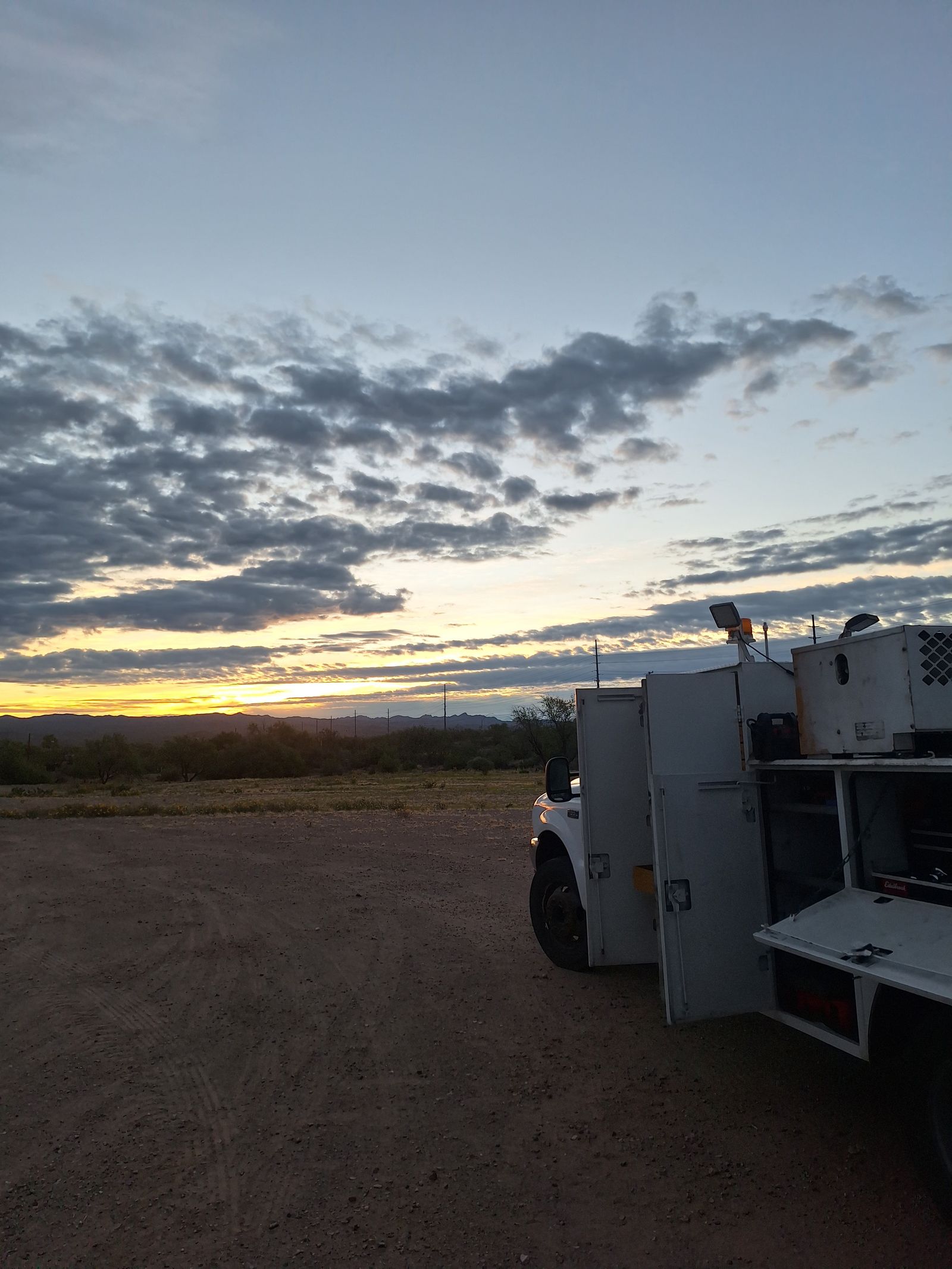 Service truck at sunset